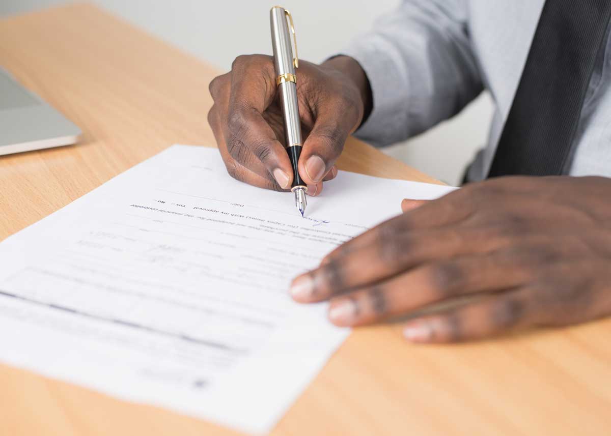 businessman signing a document