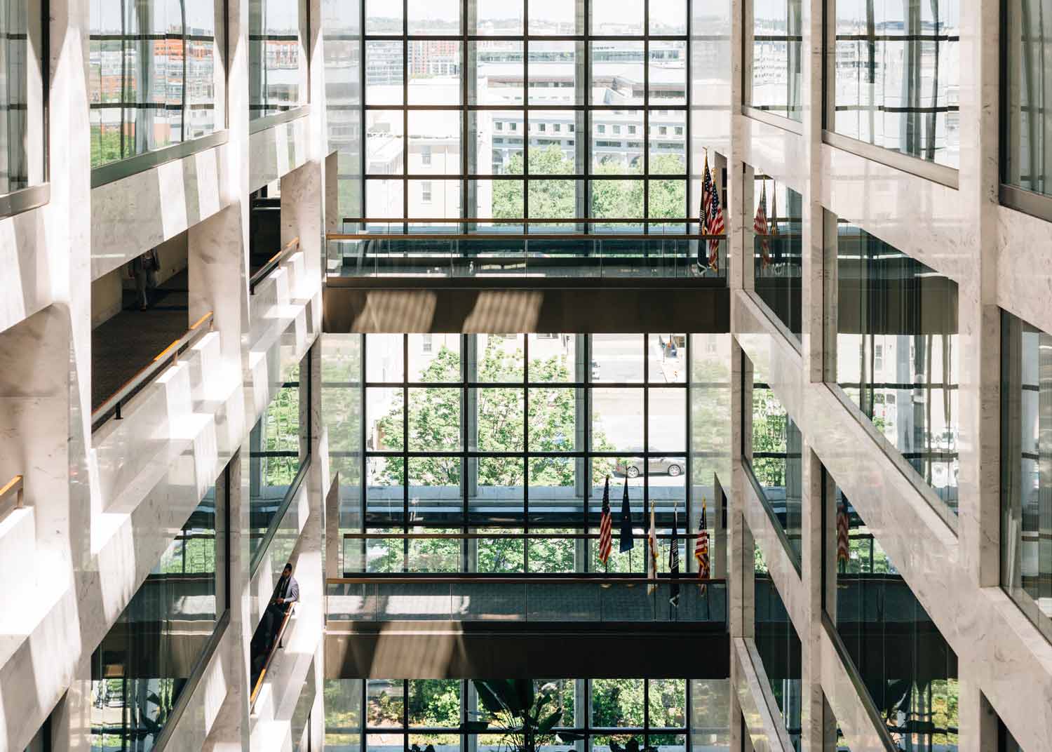 inside a large scale business building with large floor to ceiling windows